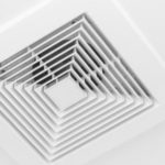 White grid-pattern ceiling vent showcasing a minimalistic design for efficient HVAC functionality at Chad's AC Direct.